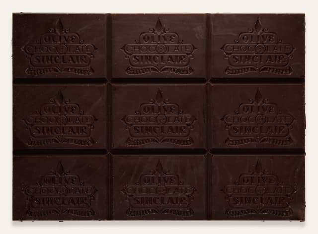 Front of 67% Cacao Nibs bar made by Olive & Sinclair Chocolate Co in the United States