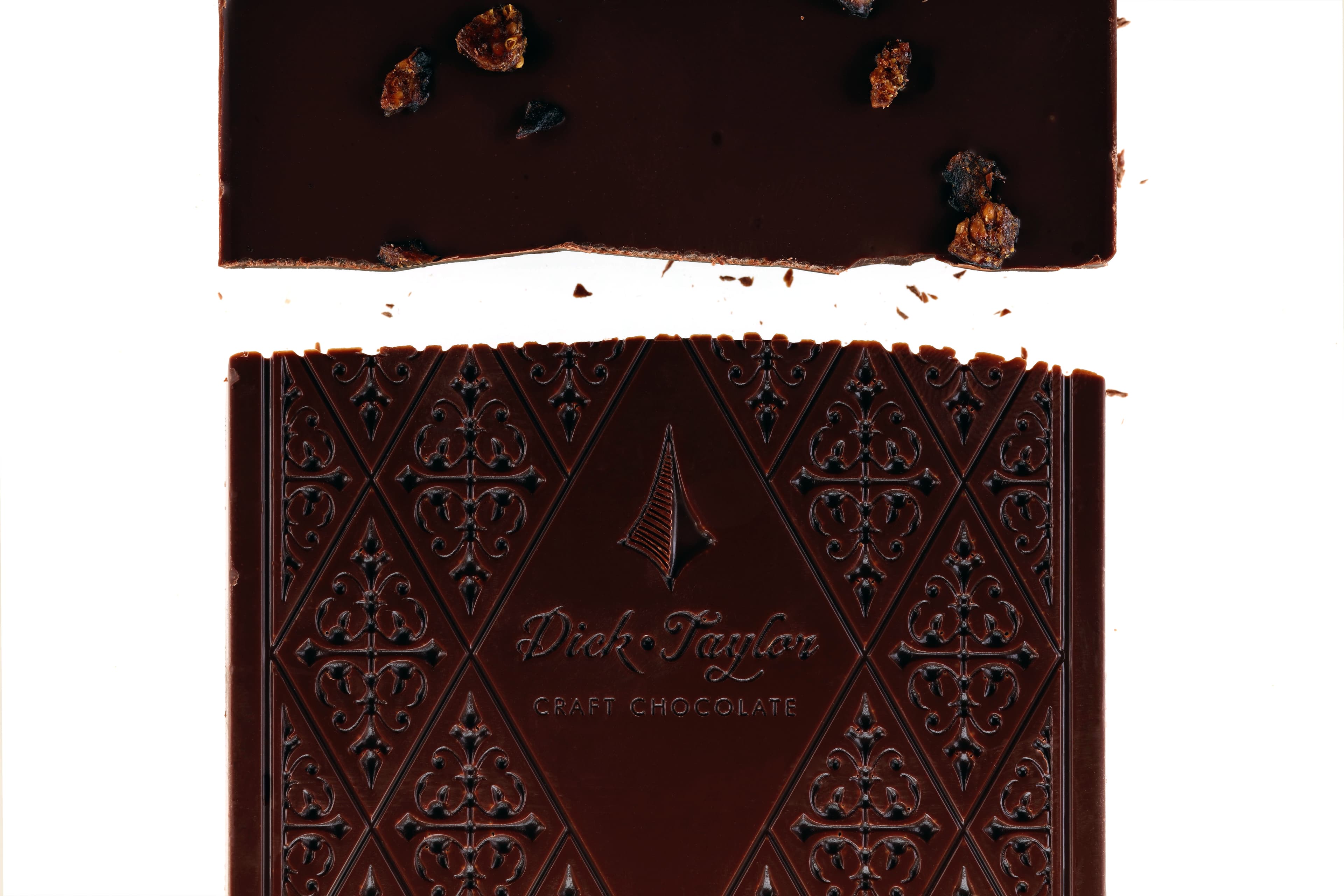 70% Dark with Black Fig bar made by Dick Taylor in the United States macro shot of the front and back of the bar