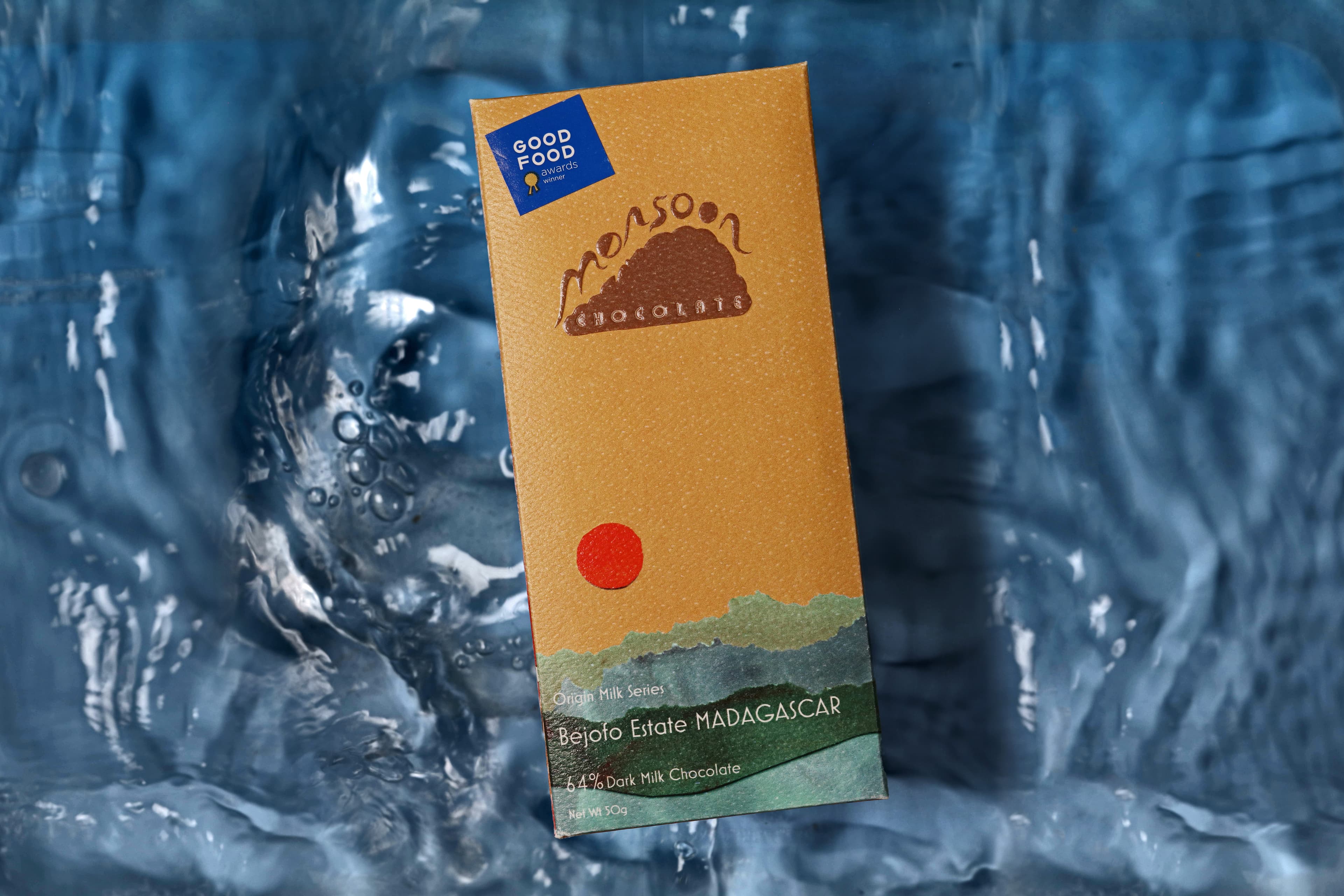 Bejofo Estate MADAGASCAR 64% Dark Milk Chocolate bar made by Monsoon Chocolate in the United States with crashing water in the background