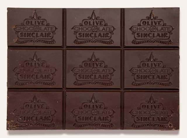 Front of Coffee Crunch bar from Olive & Sinclair Chocolate Co with a custom branded bar