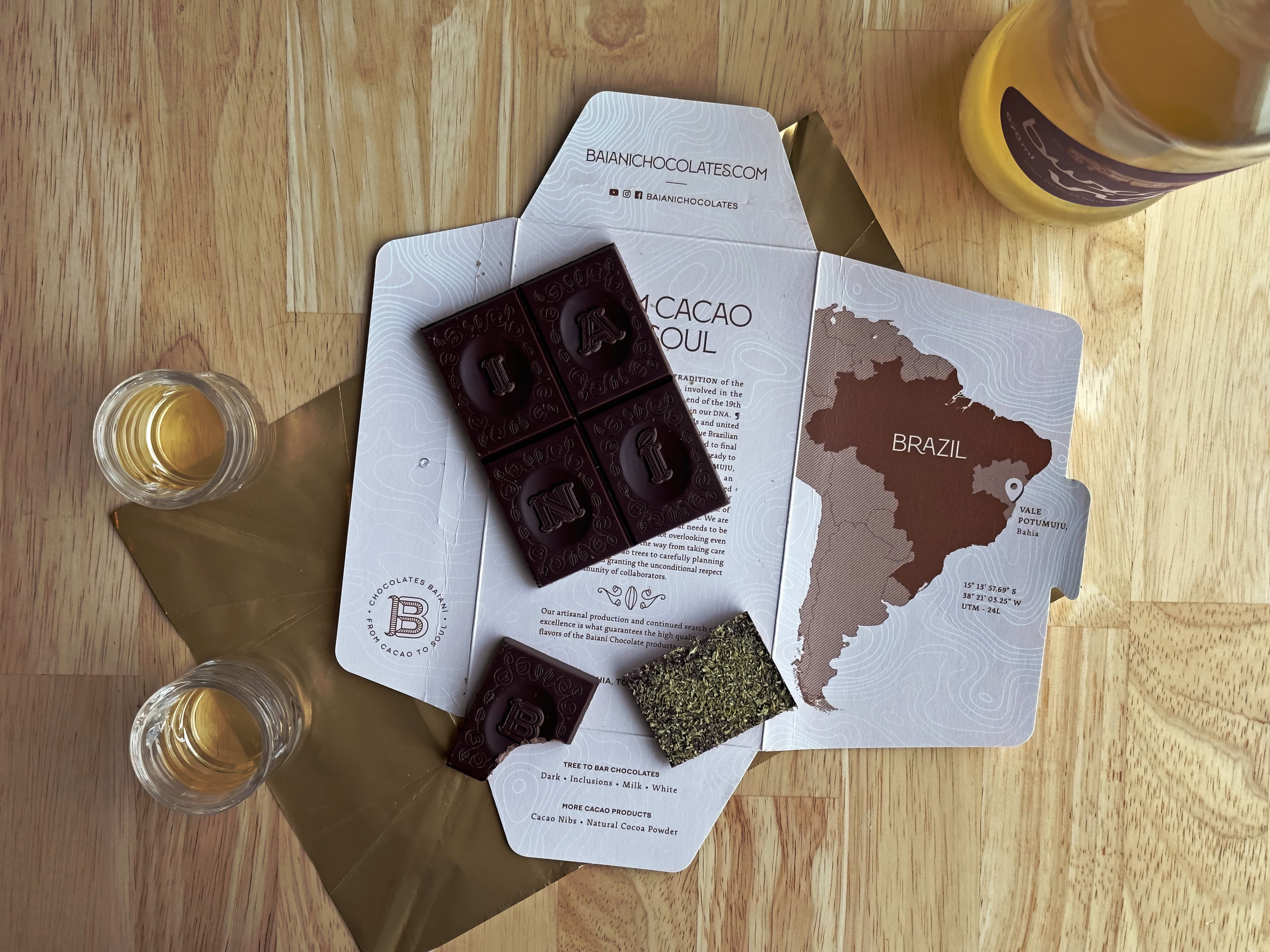 Dark Chocolate with Caipirinha bar made by Baianí Chocolates in Brazil arranged as a grid on a blue background