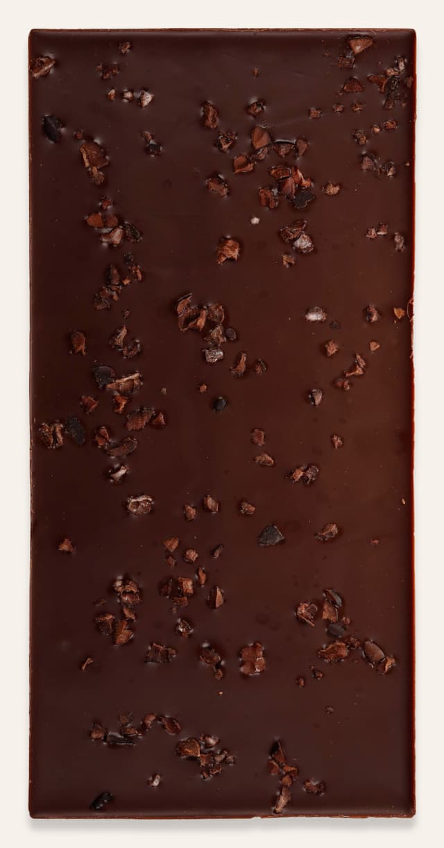 Back of Dark Milk Cacao Nibs 62% bar made by Schoki Chocolate in Canada