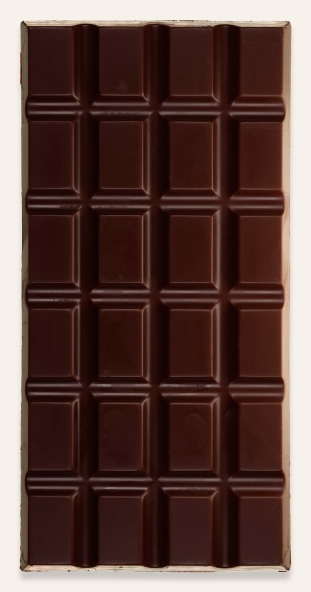 Front of Dark Milk Cacao Nibs 62% bar made by Schoki Chocolate in Canada