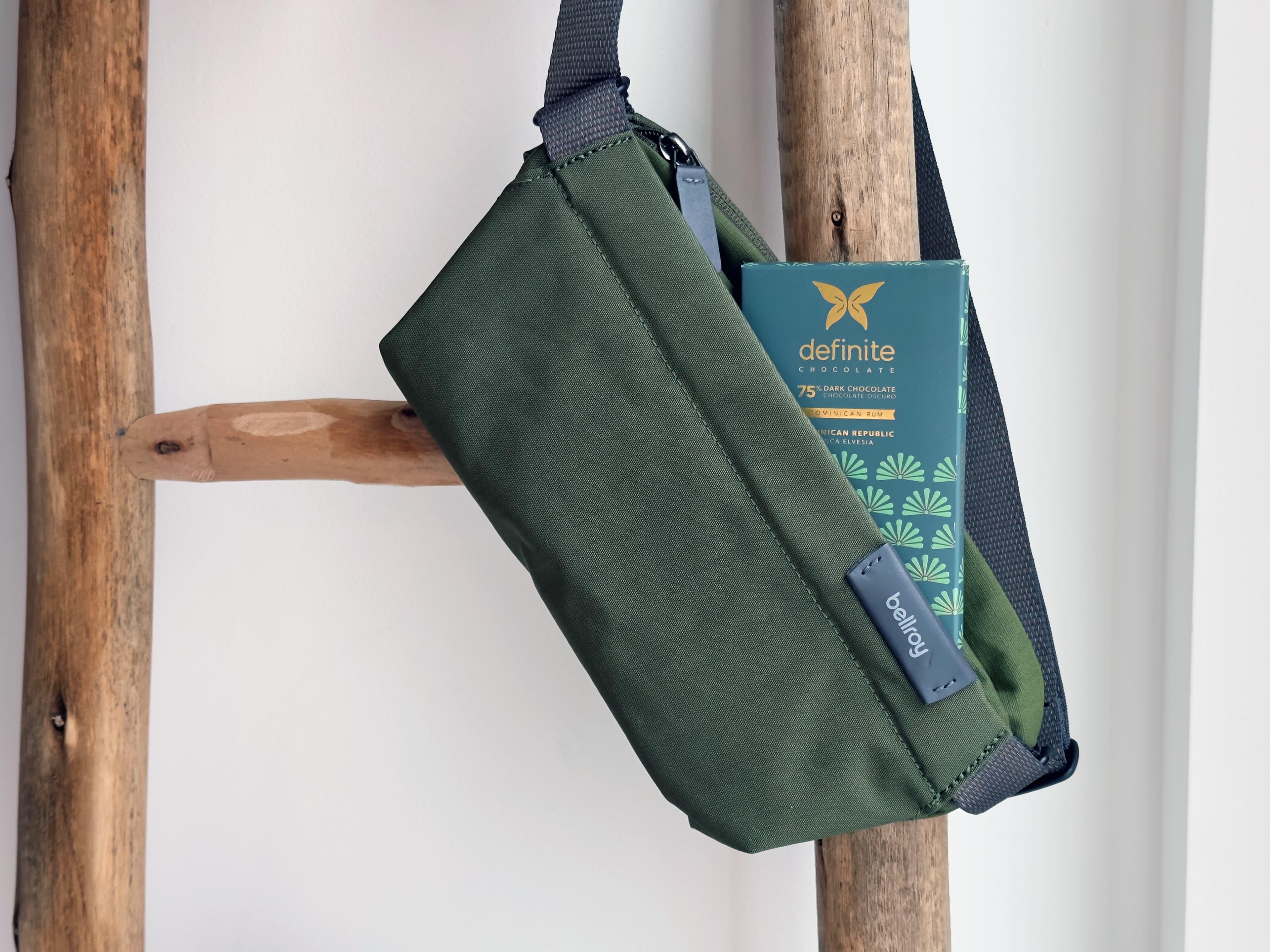 Dominican Rum Finca Elvesia bar made by definite chocolate in the Dominican Republic hanging on a wall with a to go bag