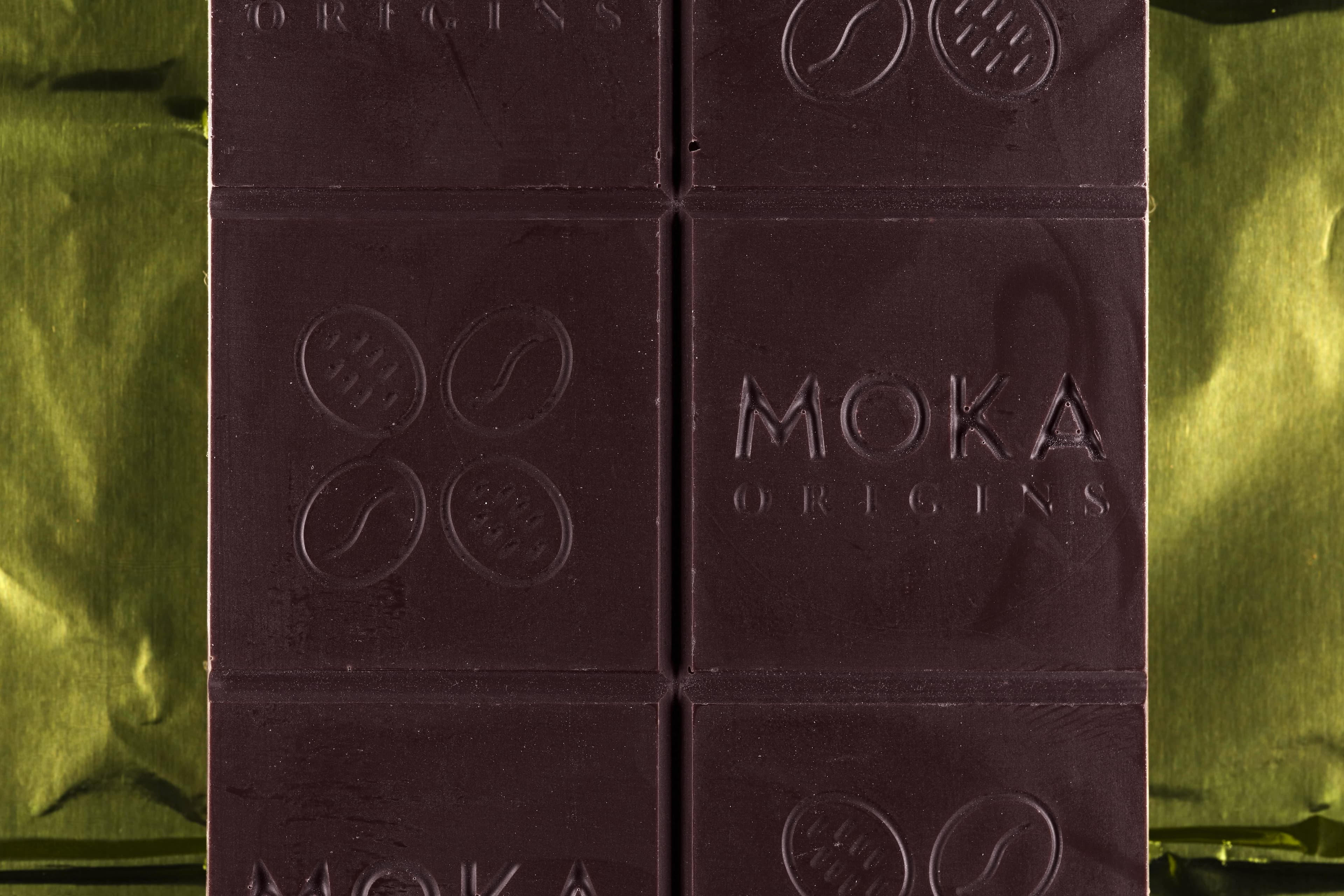 Ghana Dark Chocolate bar made by Moka Origins in the United States up close macro shot of the front of the bar