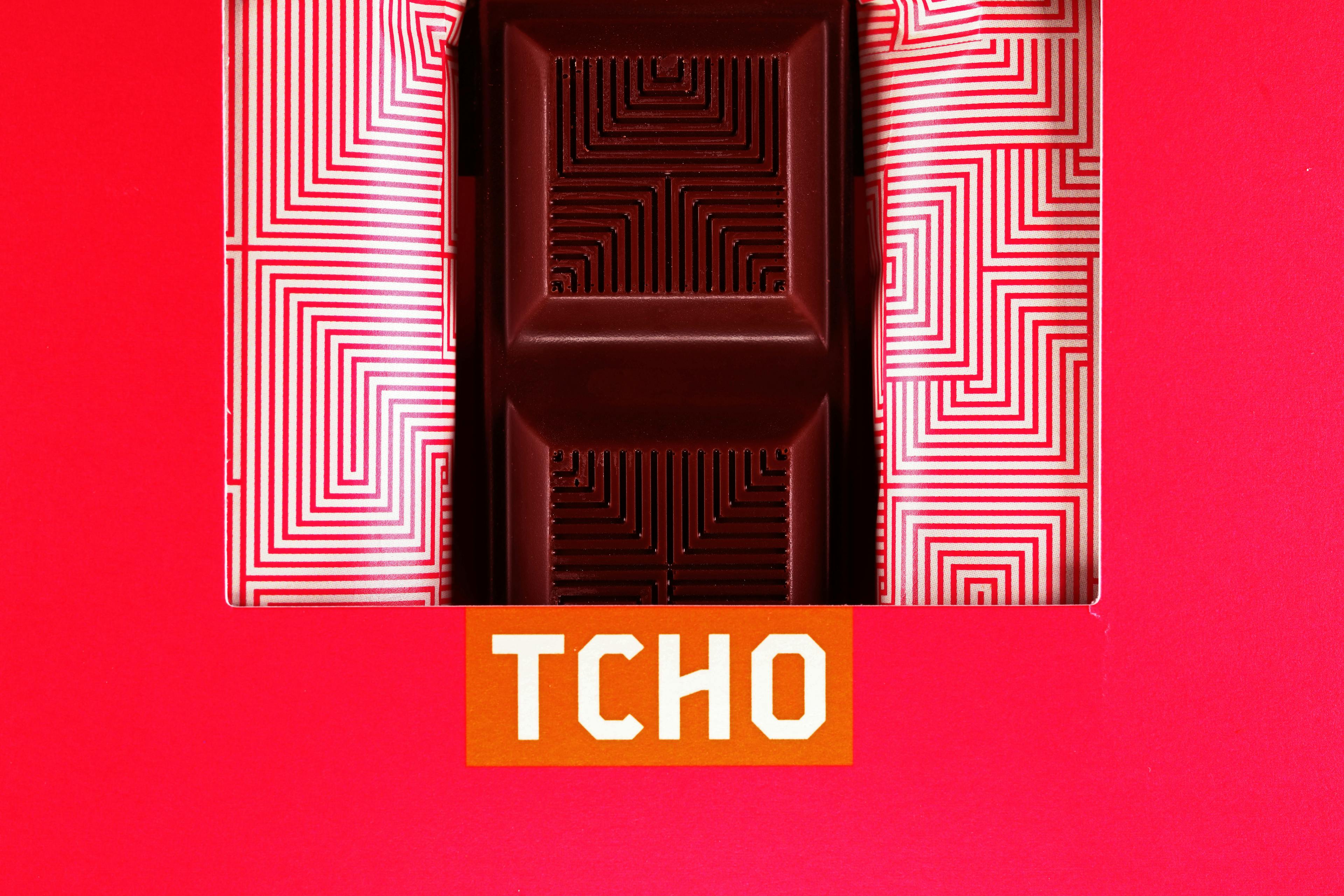 Born Fruity Lush & Fruity Cacao Truffle Filled Dark Chocolate bar made by TCHO in the United States macro shot of the bar inside the box packaging