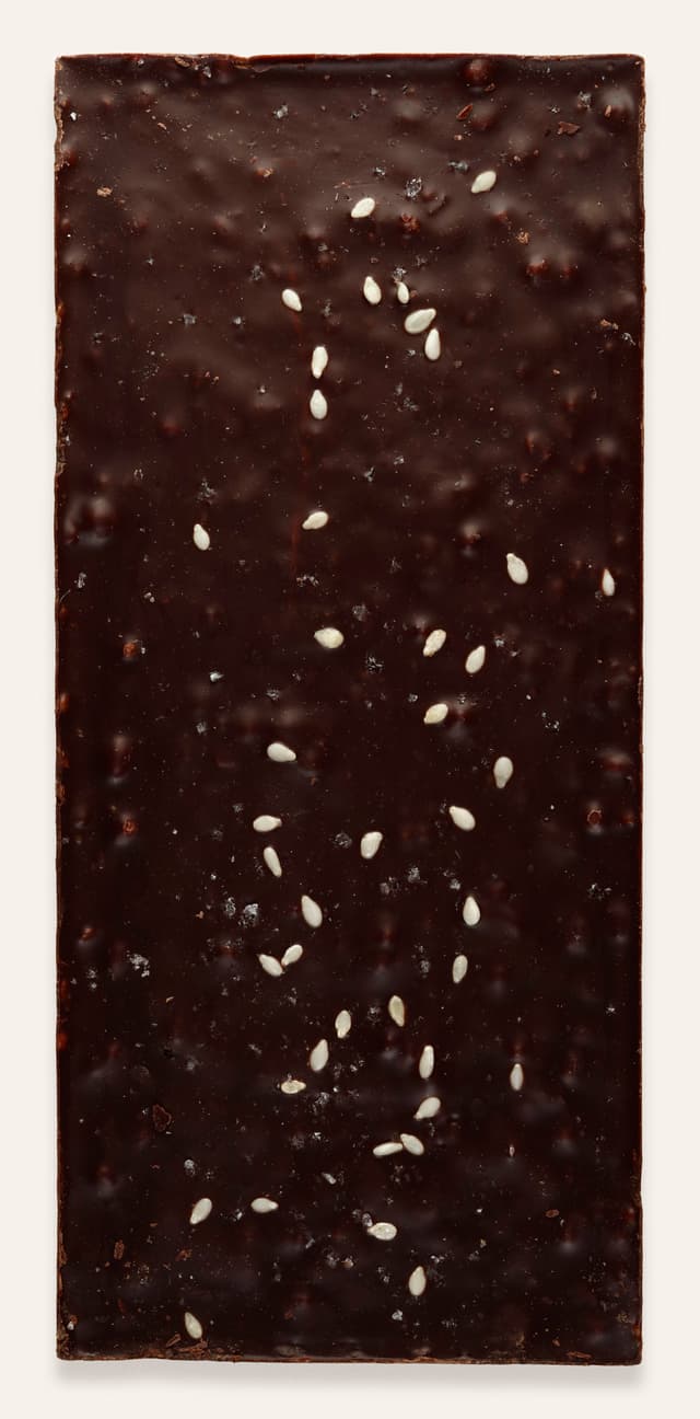 Back of Momofuku Chili Chocolate Crunch bar made by Raaka Chocolate in the United States