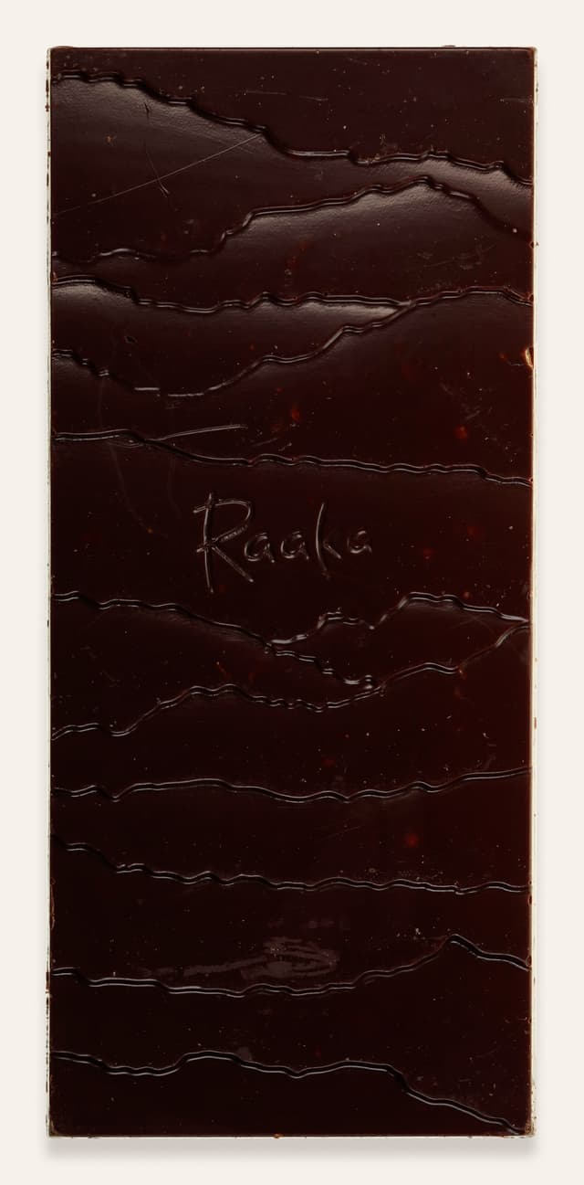 Front of Momofuku Chili Chocolate Crunch bar made by Raaka Chocolate in the United States