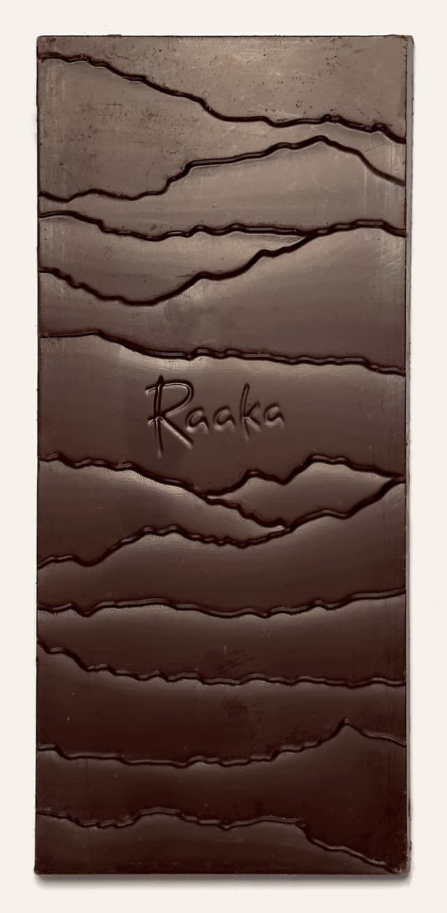 Front of Pink Sea Salt Unroasted Dark Chocolate bar from Raaka Chocolate with a custom branded bar