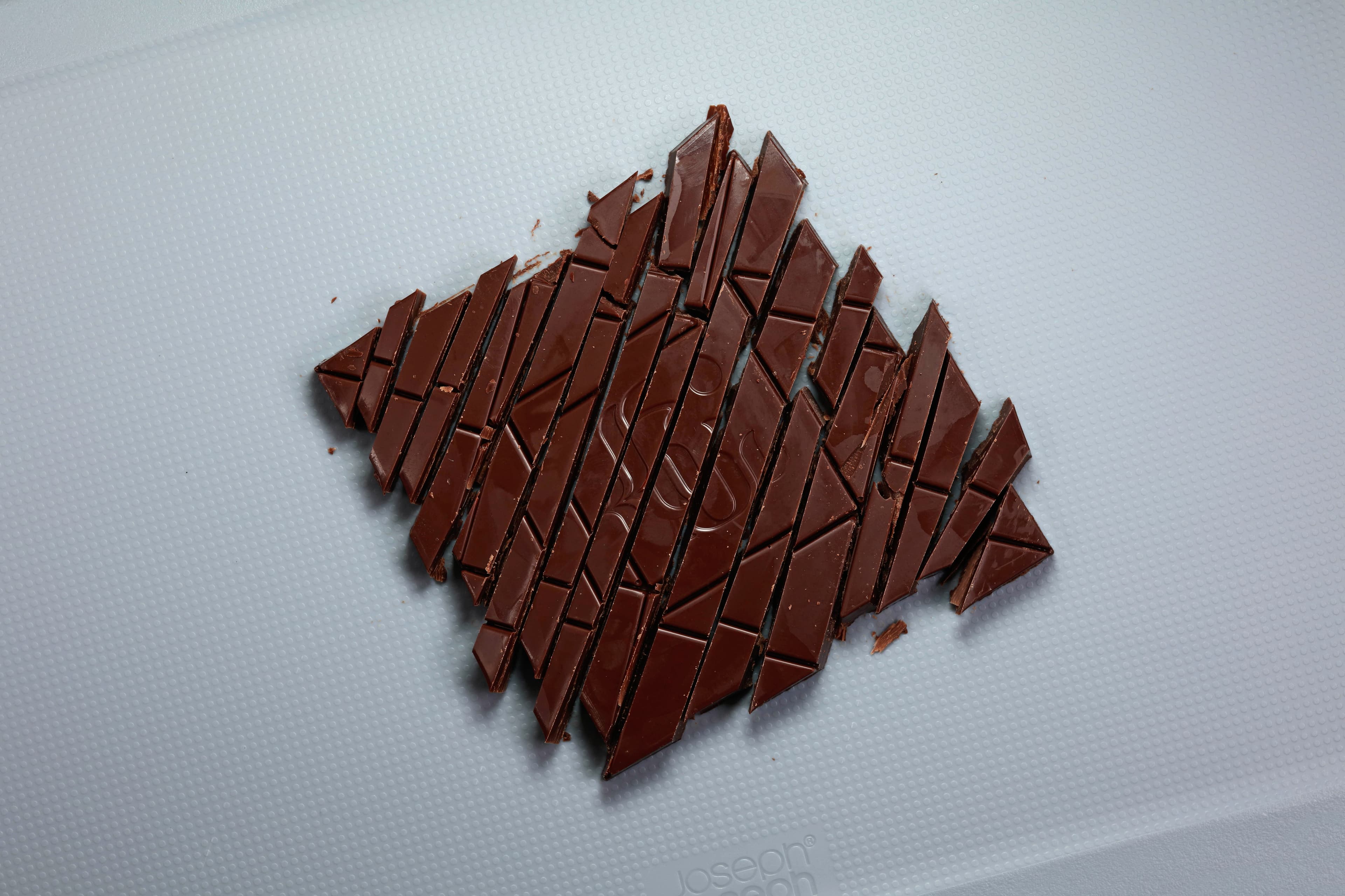 Pure Nacional 80% Pure Nacional from Peru bar made by Goodio in Finland with with the bar diagonally chopped up into many pieces