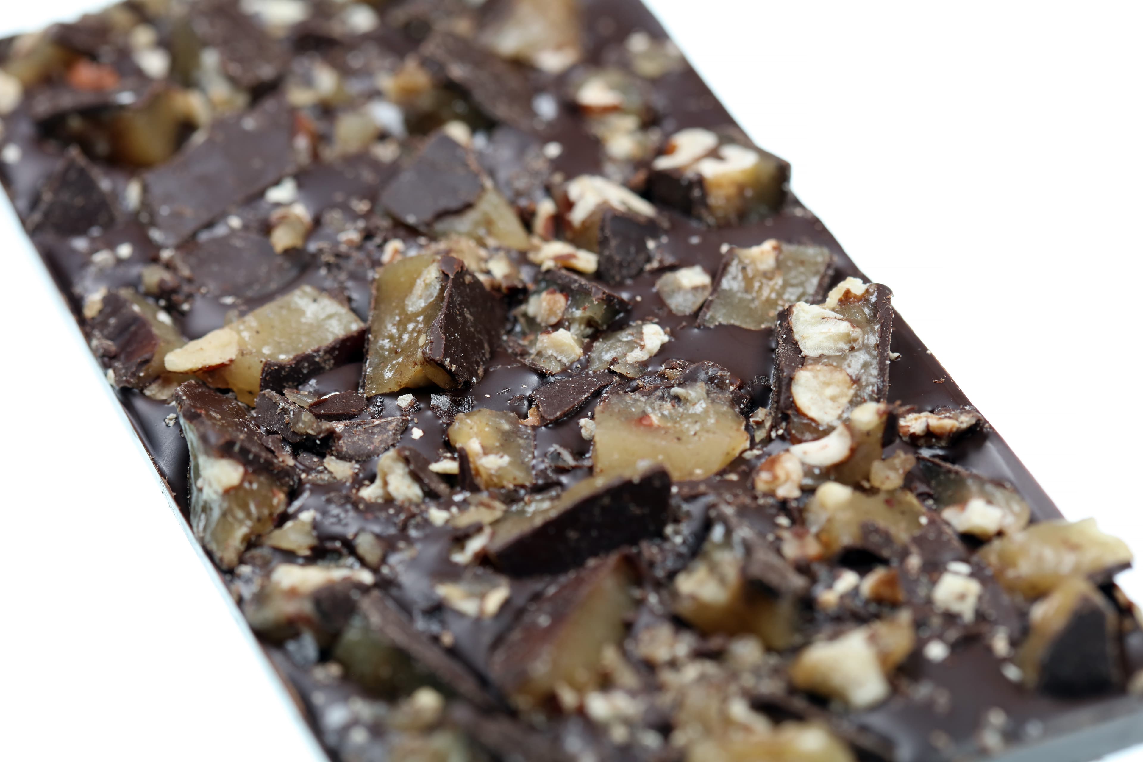 Salted Brown Butter Texas Pecan Brittle bar made by Wildwood Chocolate in the United States close up macro shot of the brittle toppings