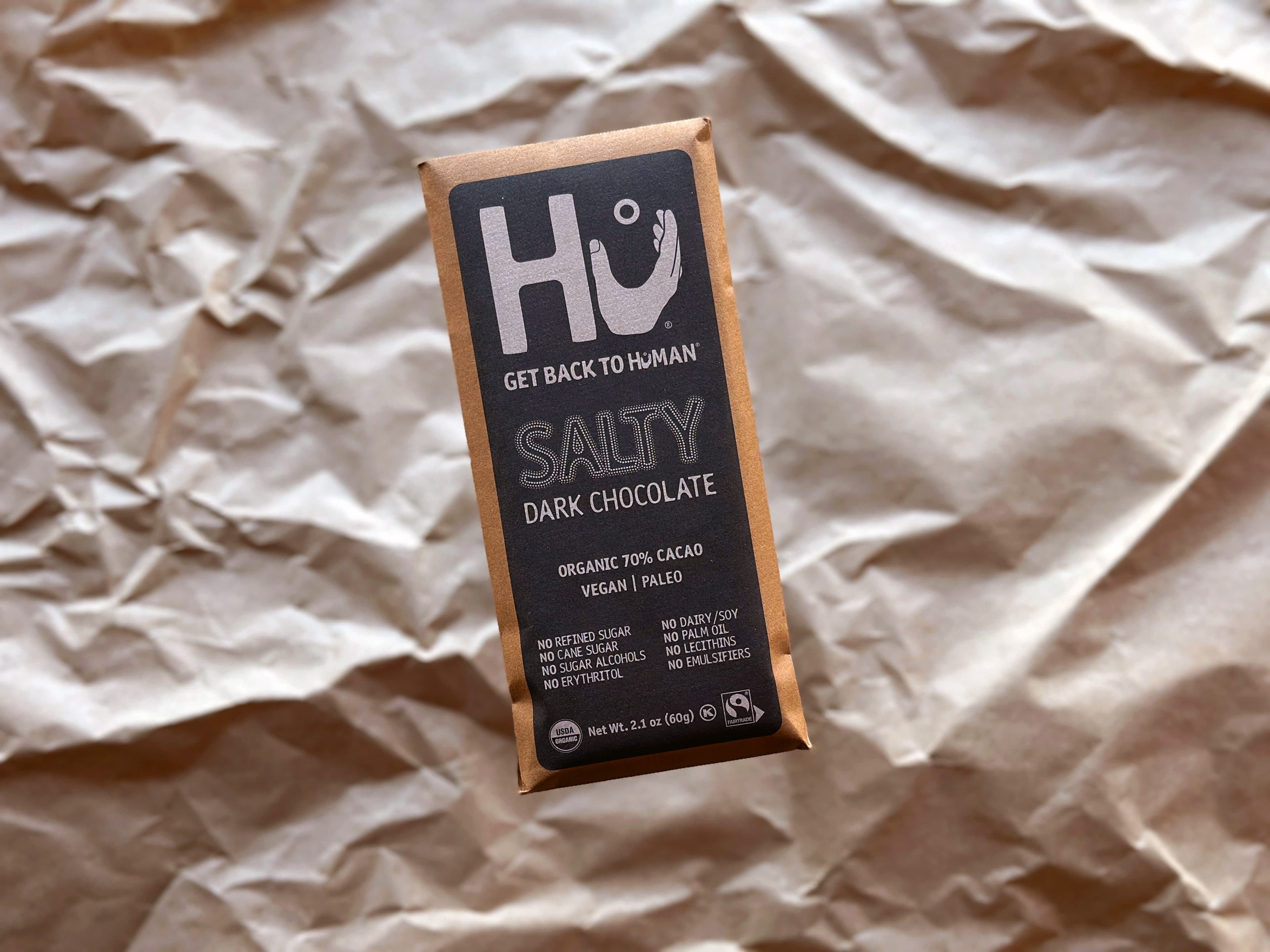 Salty Dark Chocolate bar made by Hu in Italy on crumpled butcher paper