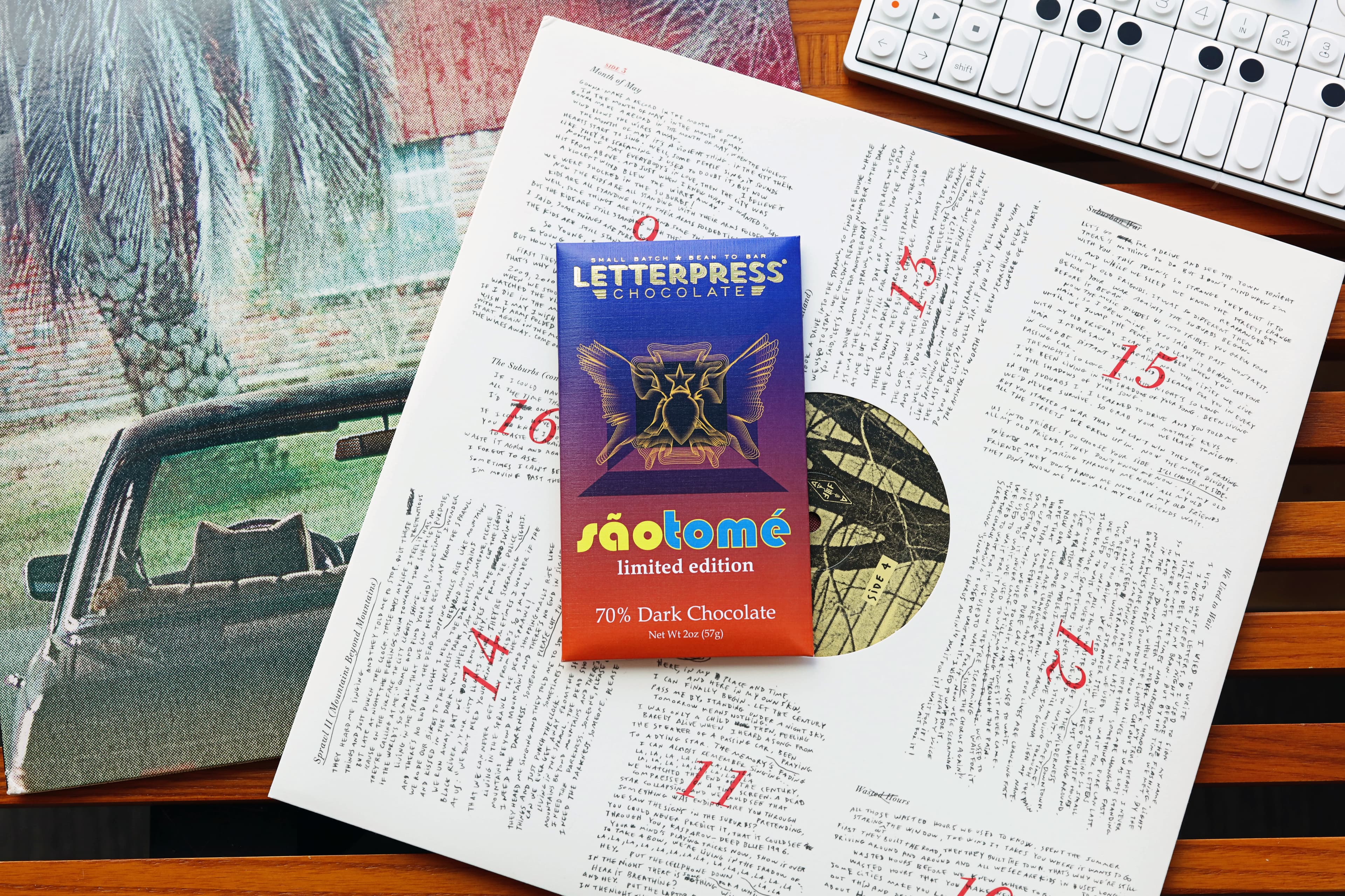 São Tomé Limited Edition 70% Dark Chocolate bar made by LetterPress Chocolate in the United States on an arcade fire Vinyl record with an OP-1