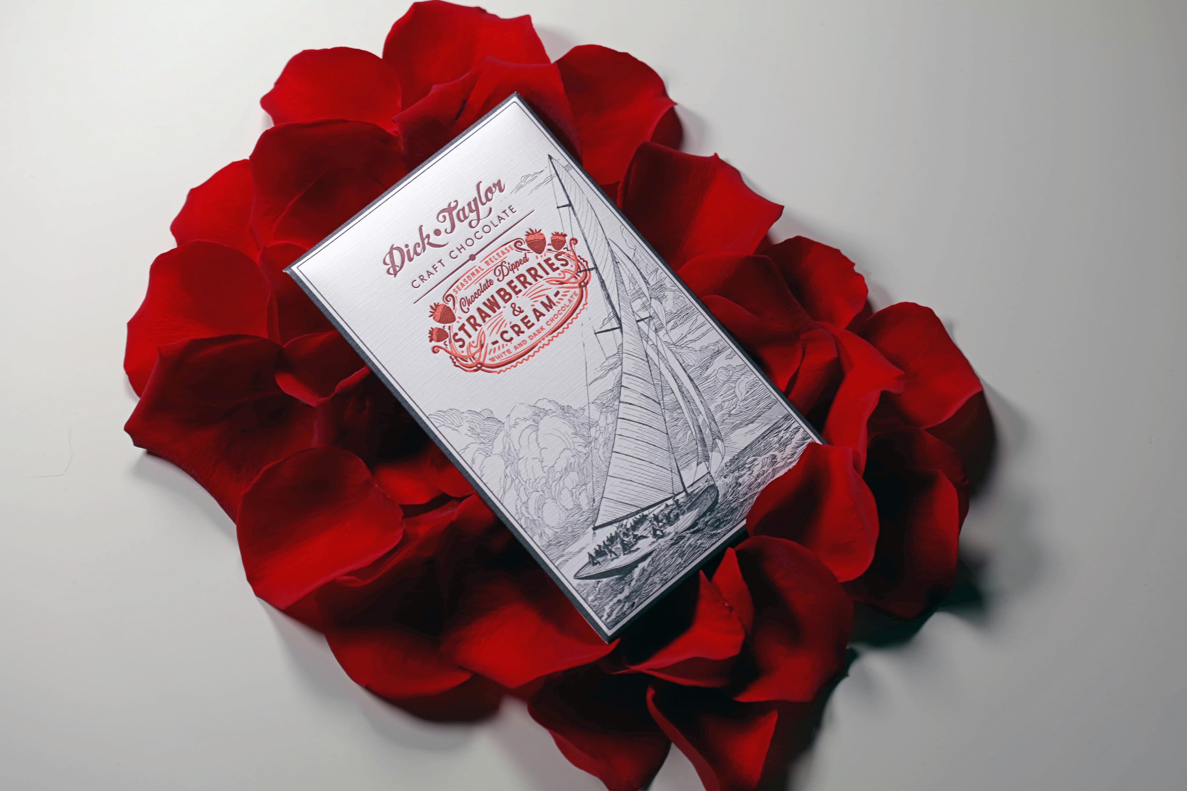 Strawberries & Cream bar made by Dick Taylor in the United States with rose petals