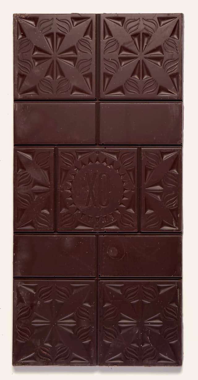 Front of Dark & Salty Dark Chocolate & Vanilla-Infused Sea Salt bar from Xocolatl Small Batch Chocolate with a custom branded bar