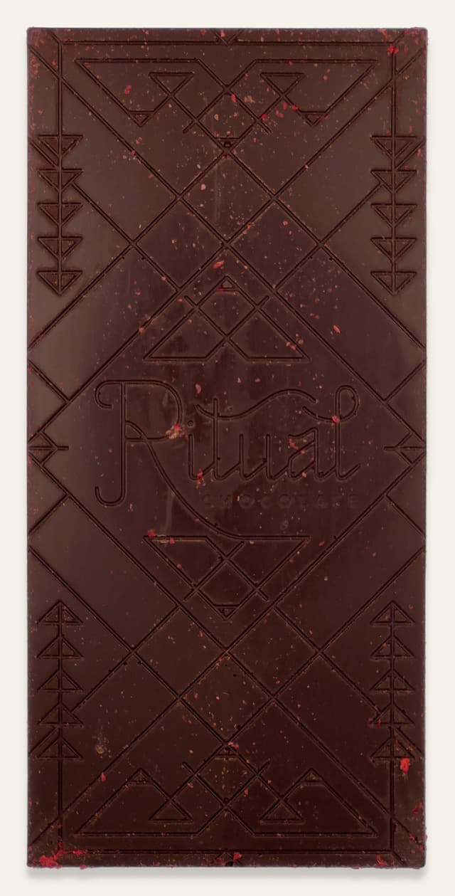 Front of The Après Chocolate Sparkling White Wine Infused Chocolate With Dried Raspberries bar made by Ritual Chocolate in the United States